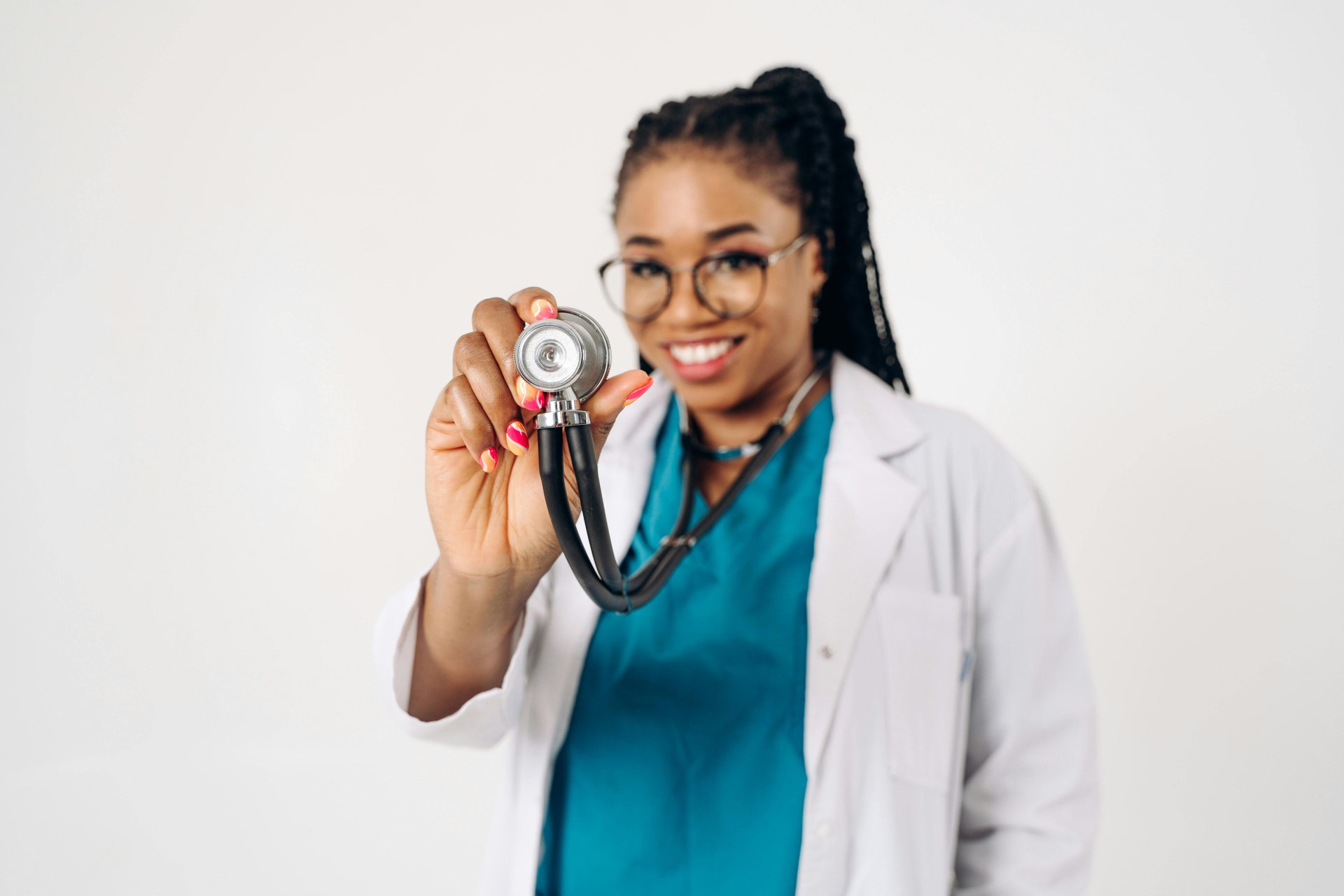 Cheerful female doctor with stethoscope promoting healthcare positivity
